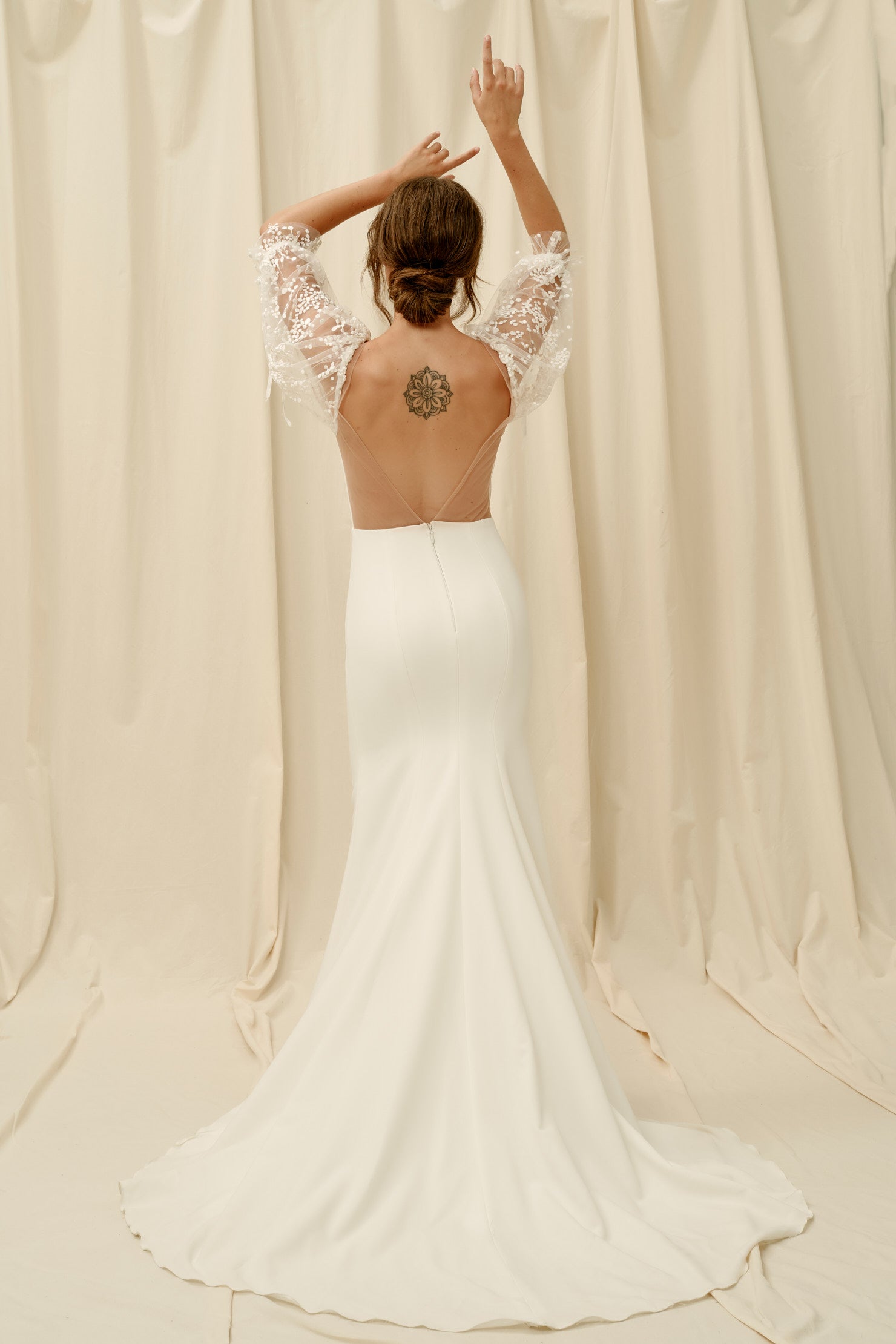 Backless crepe wedding dress with lace sleeves