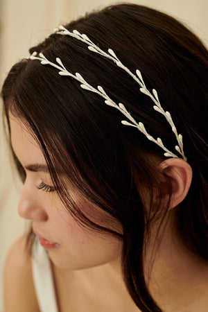 Unique and delicate wedding headband featuring two strands of wax orange blossoms