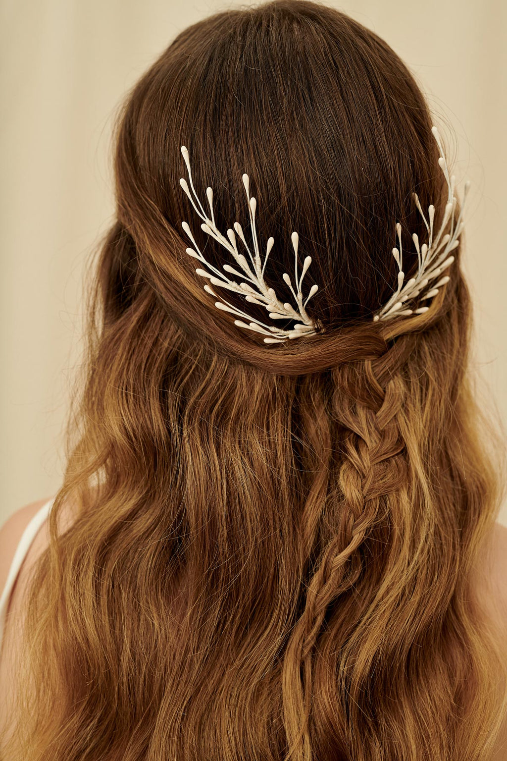 A set of fairytale bridal hair pins made with wax orange blossoms