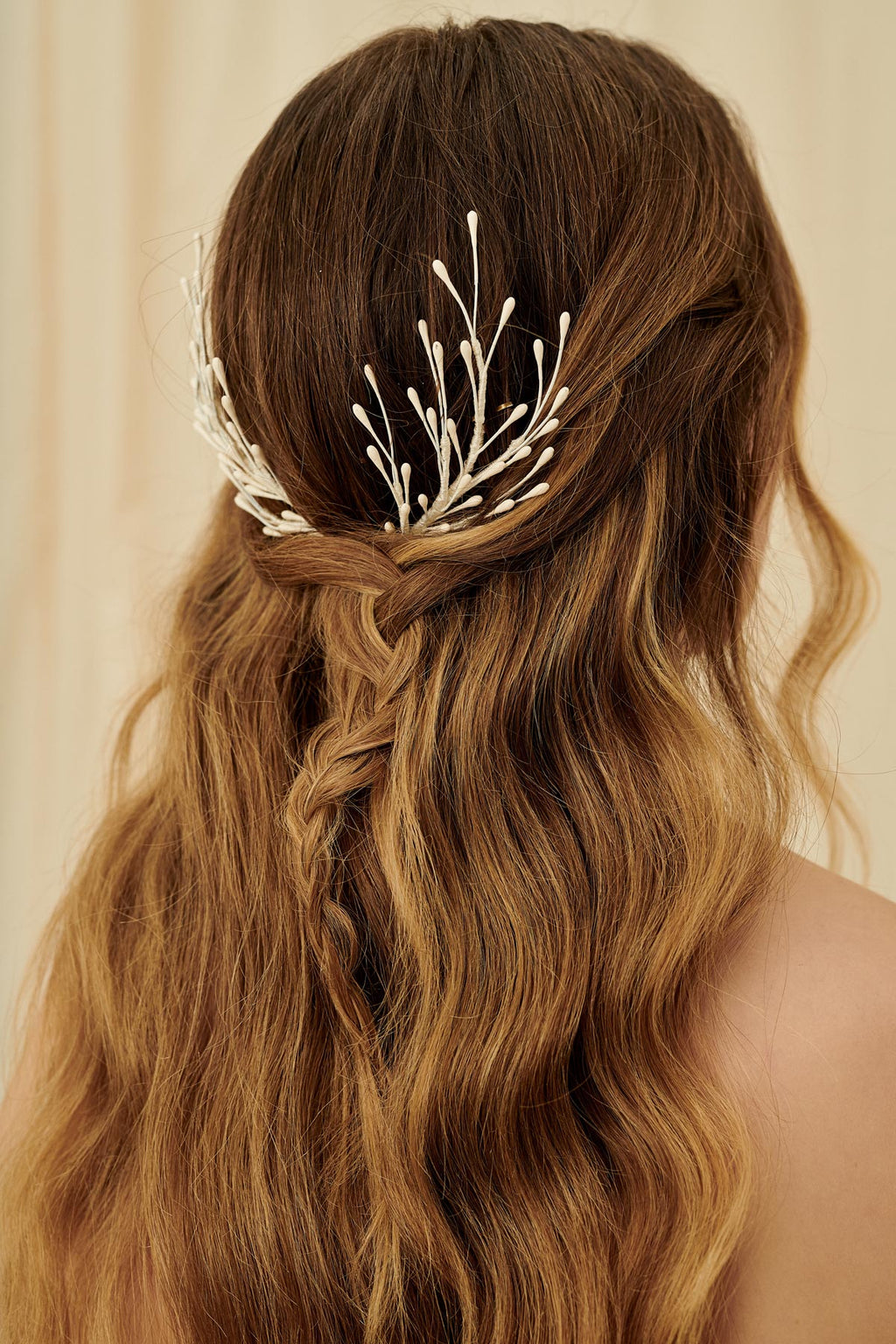 A set of fairytale bridal hair pins made with wax orange blossoms