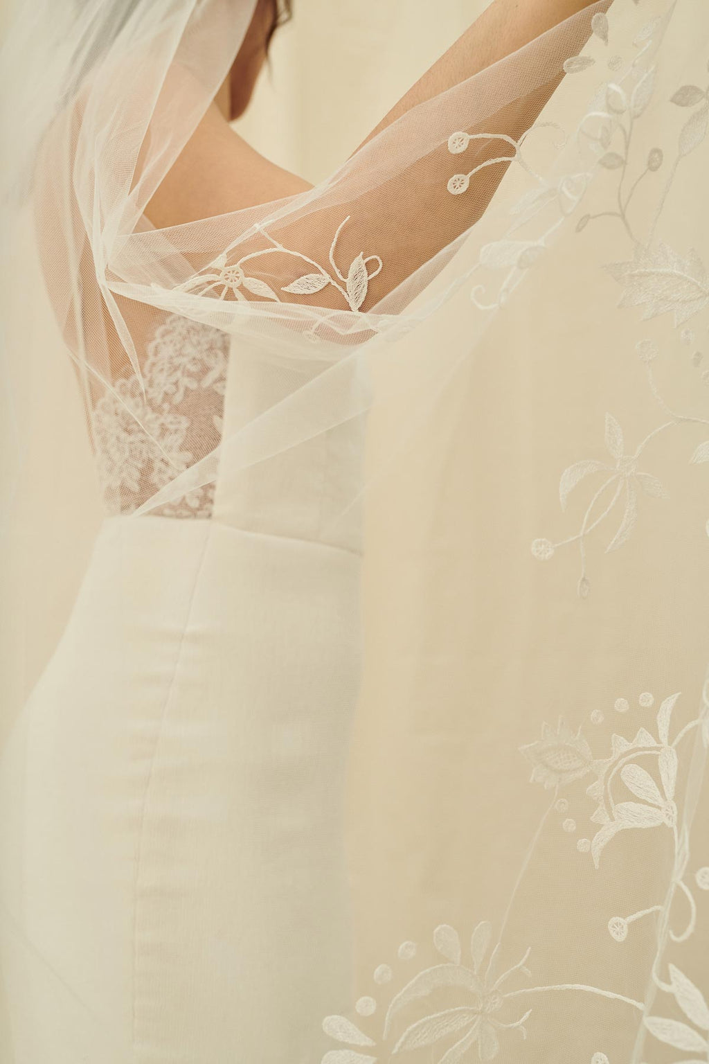 A delicate bridal veil with floral embroidery
