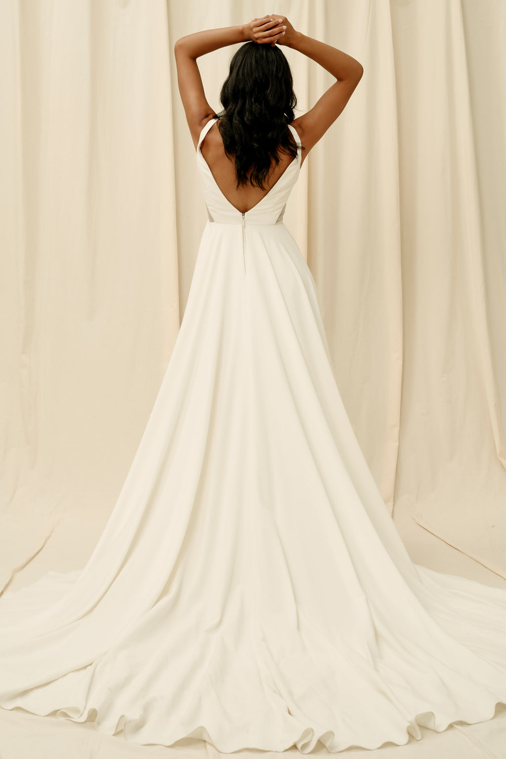 Backless crepe wedding dress with extra long train