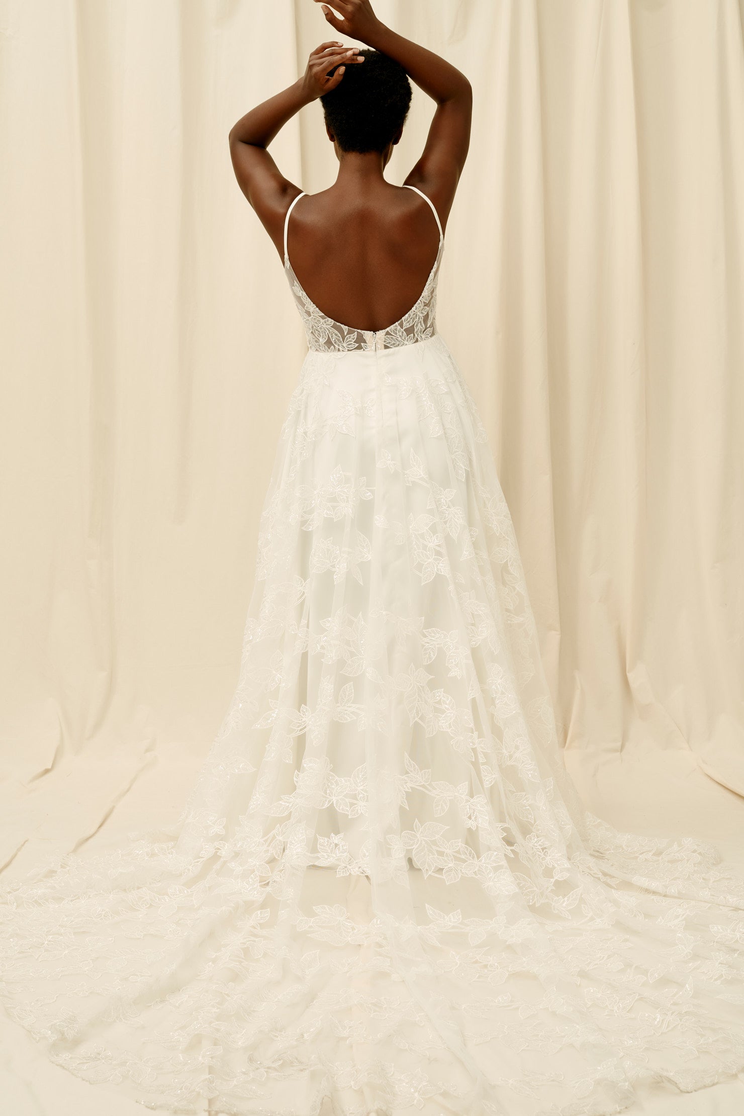 Backless wedding dress with botanical lace and spaghetti straps